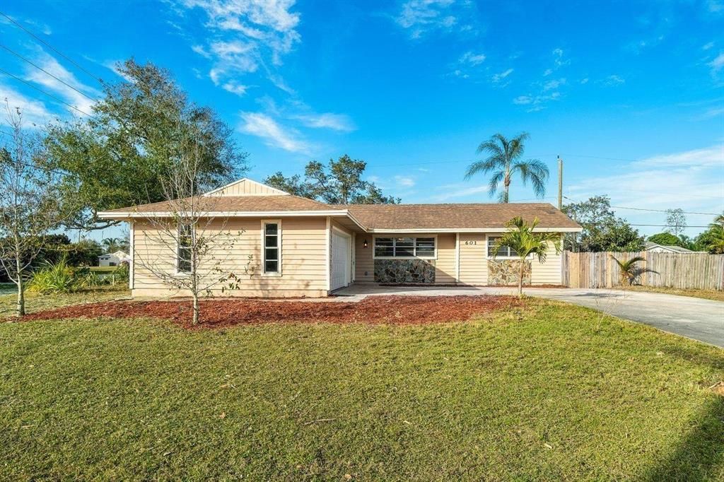 Photo of 601 SE Crescent Ave Avenue, Port Saint Lucie, FL 34984 (MLS # R10801251)