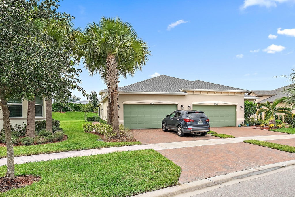 Photo of 12922 SW Lake Fern Circle, Port Saint Lucie, FL 34987 (MLS # R11015865)