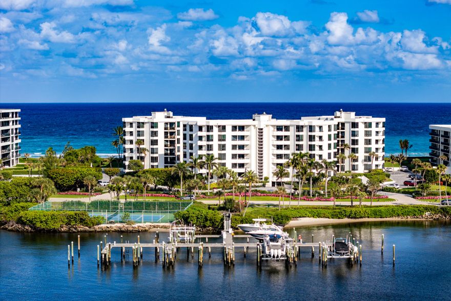 Bring your boat and your offers! Experience unparalleled resort style luxury in this elegant penthouse in Palm Beach. This corner unit offers stunning views of the Atlantic Ocean and the Intracoastal Waterway. With only two units on this floor, enjoy ultimate privacy and tranquility. With 2,497 sq. feet, this sophisticated 2-bedroom, 2 .5 bath residence features 9-foot ceilings, gleaming hardwood floors and three balconies. The beautifully updated kitchen has Thermador appliances and an island for eating. The updated kitchen and bathrooms add a modern touch to this coastal retreat. Enjoy the convenience of an in-unit laundry room which includes a second full-size refrigerator. Included in the sale is a large boat slip accommodating a vessel up to 39 feet.   Residents enjoy world-class amenities including an oceanfront saltwater pool with towel service, tennis and pickleball courts, three fitness centers, and 24-hour concierge security. Complete with garage parking and a prime location near elite dining and shopping, this is the pinnacle of Palm Beach living.