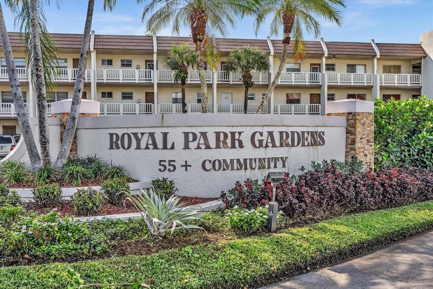 Enjoy life in this well-maintained 55+ community  of Royal Park Gardens.  Pride of ownership shows in every aspect of this well appointed condo.  Park directly in front of your ground floor unit.  This condo offers a unique kitchen and is well protected from any type of inclement weather. Hurricane shutters on all windows, plus hurricane impact windows in the living room and patio.  The patio is enclosed for all weather use and is used as an additional room.   Kitchen snack bar has additional storage space.  Large tile throughout.  Amenities include pools,  tennis, pickleball, and bocce.  Laundry room and storage areas on the first floor are close to the unit.  Building has its own party and exercise rooms.