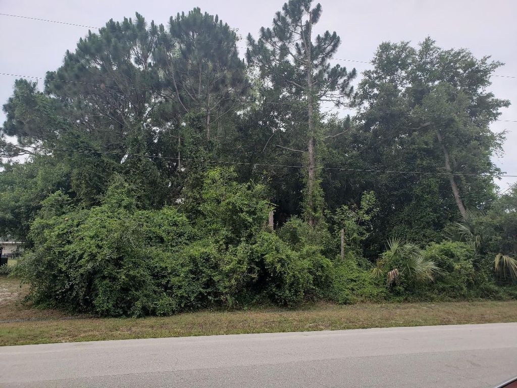 Photo of 462 SW Sansom Sw Lane, Port Saint Lucie, FL 34953 (MLS # R10715736)