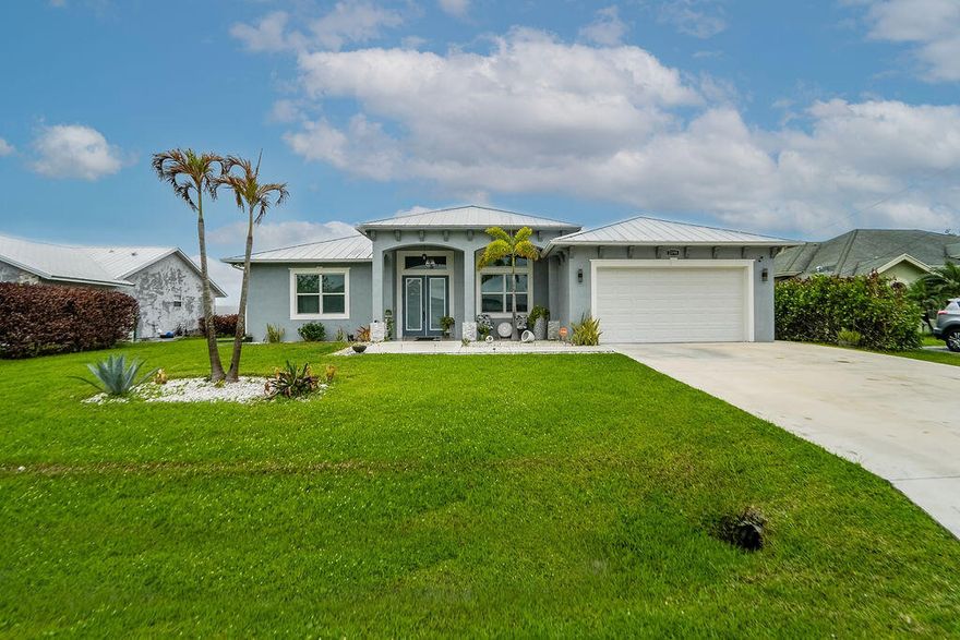 Welcome to your dream home! This impeccably maintained, nearly new 3-year-old residence offers 5 bedrooms, 4 baths, plus a versatile den, along with a thoughtfully converted garage efficiency. Set on a generous quarter-acre lot, the home showcases stunning lake views and a bright, open floor plan enhanced by elegant tray ceilings. The chef-inspired kitchen flows seamlessly into the living space, complete with an electric fireplace—perfect for entertaining. Impact windows and a durable metal roof provide both style and peace of mind. Enjoy boating and skiing right from your backyard, all while being conveniently close to shopping, dining, and everyday essentials.