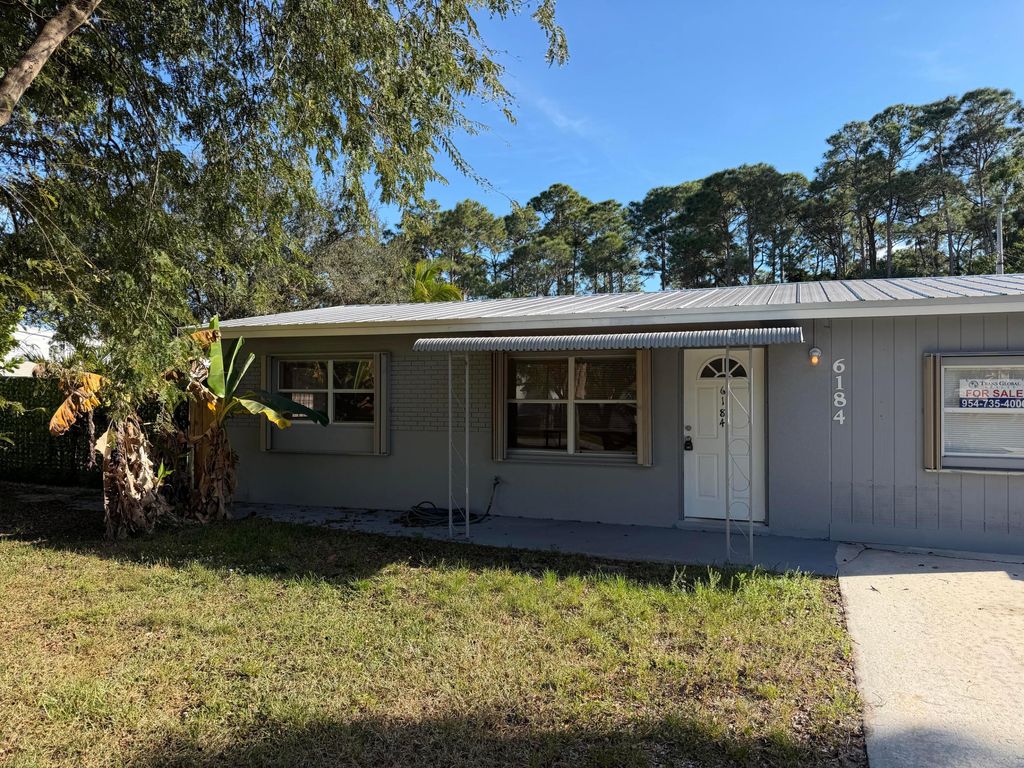 Photo of 6184 SE Orange Blossom Trail SE, Hobe Sound, FL 33455 (MLS # B26007825)