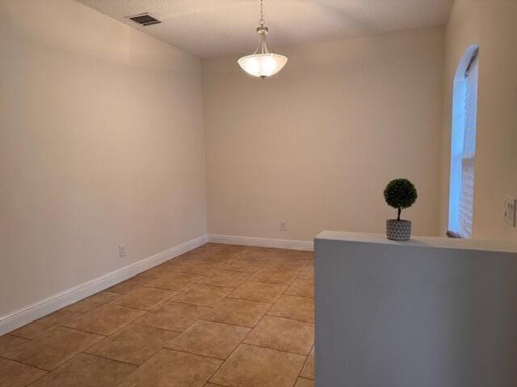 Photo of 237 SW Grove Avenue, Port Saint Lucie, FL 34983 (MLS # R11146666)