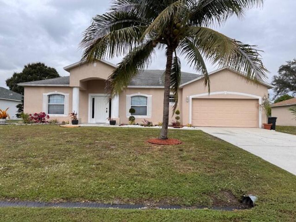Photo of 237 SW Grove Avenue, Port Saint Lucie, FL 34983 (MLS # R11146666)