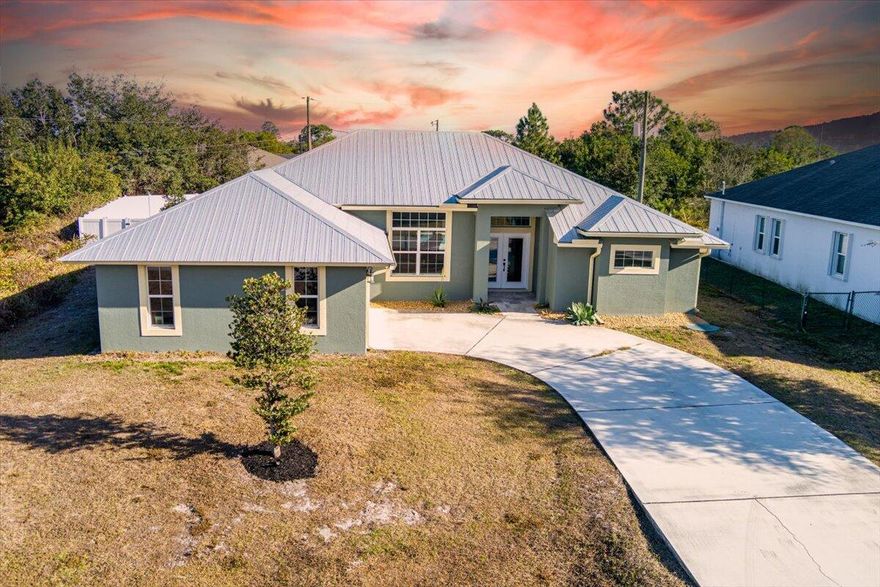 Newer construction on a larger-than-standard lot, backing to partial open green space for extra privacy. Inside, high ceilings and sun-filled living areas create an airy feel, with a modern kitchen and an easy, open flow for everyday comfort and entertaining. The split primary suite features a spacious bath and generous storage; secondary bedrooms are well sized. Step outside to an amazing pool and spa/hot tub with a covered lanaiâ”your year-round retreat. Close to I-95 for easy commuting, but yet tucked away on a quite street