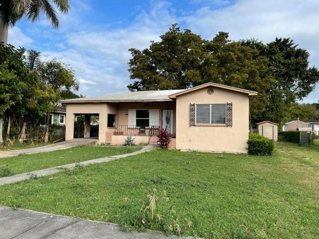 Photo of 148 S Flame Avenue, Pahokee, FL 33476 (MLS # R10999982)