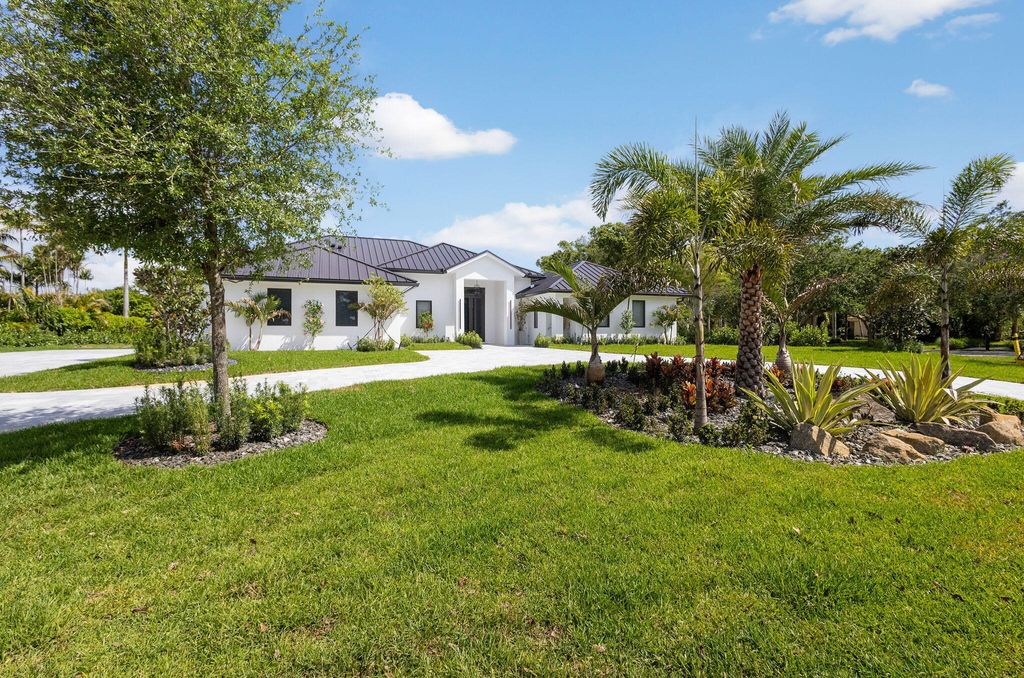 Photo of 8771 Man O War Road, Palm Beach Gardens, FL 33418 (MLS # B26009242)