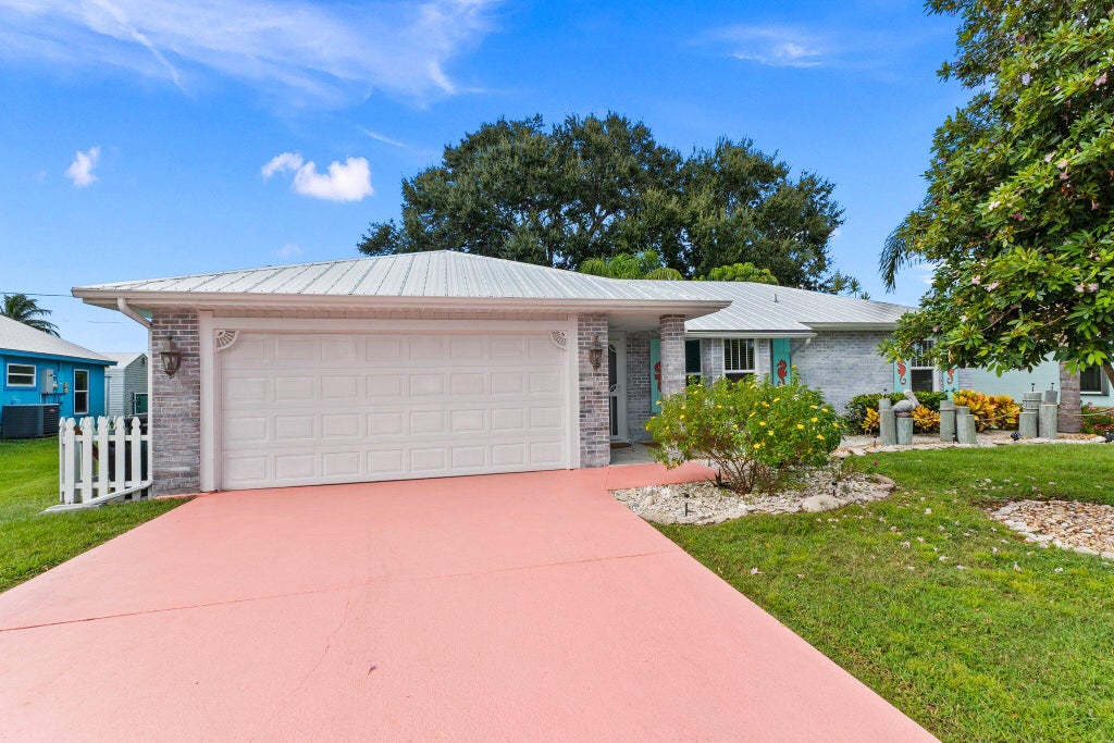 Photo of 2114 SE Midtown Road, Port Saint Lucie, FL 34952 (MLS # R11028452)