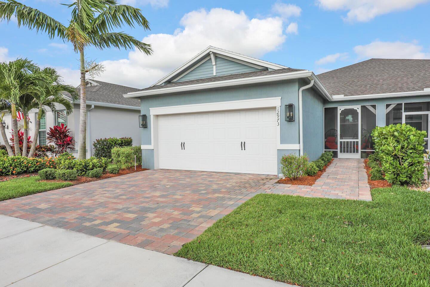 *Motivated sellers* and a great price on this gorgeous villa in Del Webb 55+ gated community! Skip the wait for new construction with this meticulously maintained move-in ready 2/2/2 villa built in 2022. The floor plan includes a flex space/den or possible 3rd bedroom. Upgrades include wired speakers for perfect entertainment, plantation shutters adorn all impact windows, granite kitchen countertops, 42'' kitchen cabinets, stainless steel appliances, gas stove, 17'' ceramic tile, crown molding, screened in/covered patio, and in garage; ceiling storage, extra closet storage/tool closets & epoxy floor! Del Webb's phenomenal community amenities include 2 gorgeous clubhouses, 2 pools, fitness center, game room, pickle ball courts, bocce ball, tennis courts, putting green & much much more!