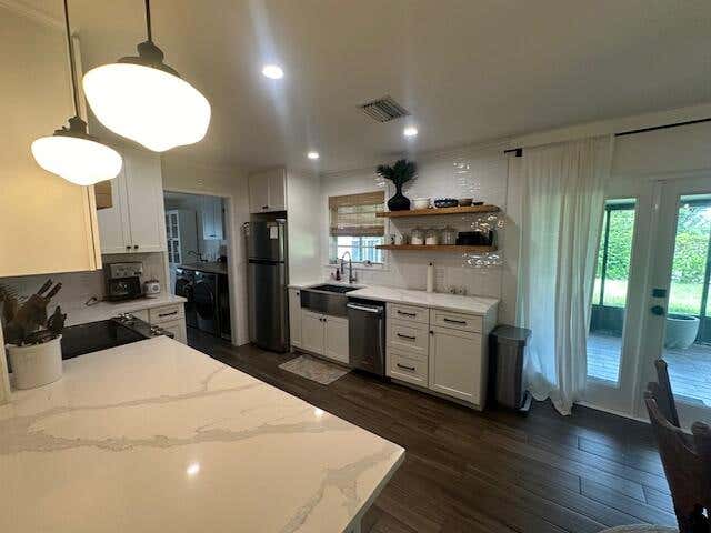 Photo of 8713 SE Sandridge Avenue, Hobe Sound, FL 33455 (MLS # R11018484)