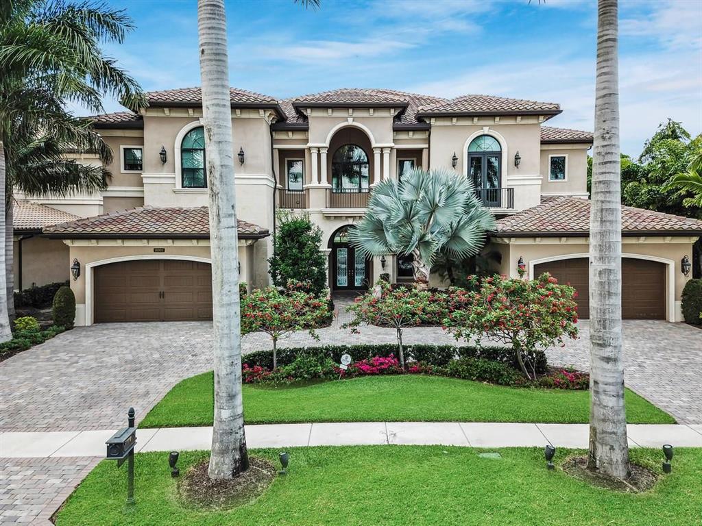 A residence of exquisite distinction awaits in this highly upgraded Palazzo model home. This well-appointed 7,518 square foot home offers plenty of space for entertaining in luxury with a formal dining room, living room, game room, media room, and loft. The gourmet kitchen is fit for a five-star chef with stacked cabinets, double islands with 3'' coastal granite countertops, Sub-Zero refrigerator, Viking stove and custom exhaust hood. The master retreat features a coffered ceiling, custom walk-in closet and French doors leading to the covered balcony. Wide plank oak flooring, marble floors, a built-in salt water fish tank and custom lighting complete this home. Enjoy your own tropical paradise with a heated salt water pool, covered patio with a summer kitchen and a serene lake view..