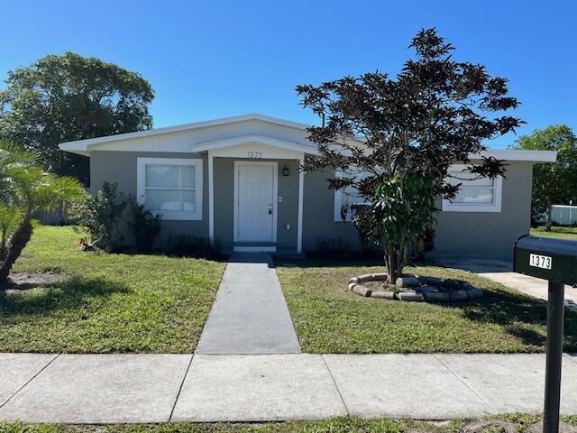New Roof Coming Soon!Welcome home to this charming 3-bedroom, 1-bath single-family residence with no HOA in Riviera Beach. This move-in-ready property features updated wood laminate flooring throughout, an open-concept kitchen with stainless steel appliances, and a split floor plan offering comfortable privacy. The spacious laundry room provides potential to easily add a second bathroom if desired. Freshly painted inside and out, this home combines comfort and convenience with a brand-new roof currently in the permitting process.