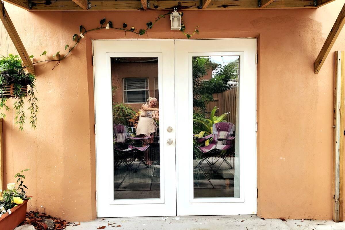 Available immediately! This charming 2-bedroom, 1.5-bath home is a peaceful retreat just 7 minutes to the beach and 10 minutes to PBI Airport and downtown West Palm Beach's vibrant dining, arts, and entertainment. Enjoy a lush garden and private patio, with French doors in the master bedroom opening directly to your own outdoor oasis. Fully fenced for privacy, with central individual A/C, on-site laundry, and easy street parking. Can be rented furnished or unfurnished to suit your needs. No HOA and an easy move-in process make this an ideal place to call home. Don't miss this rare find in a prime location!