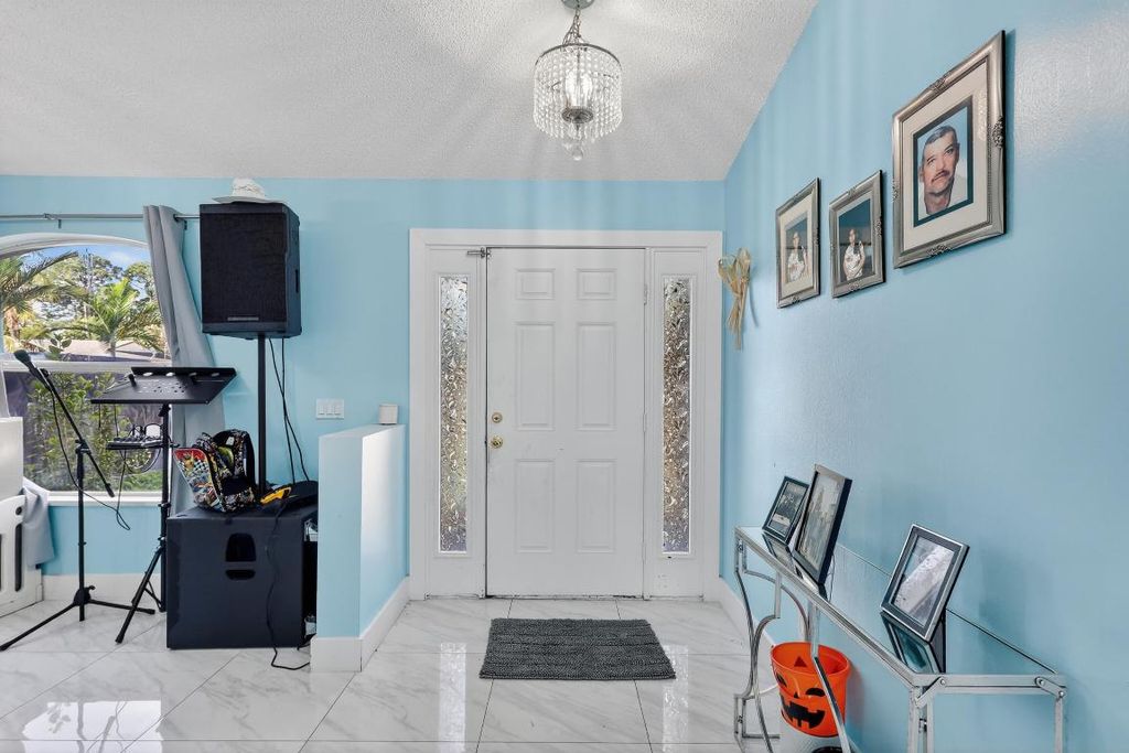 Photo of 1121 SW Ivanhoe Street, Port Saint Lucie, FL 34983 (MLS # R11157125)