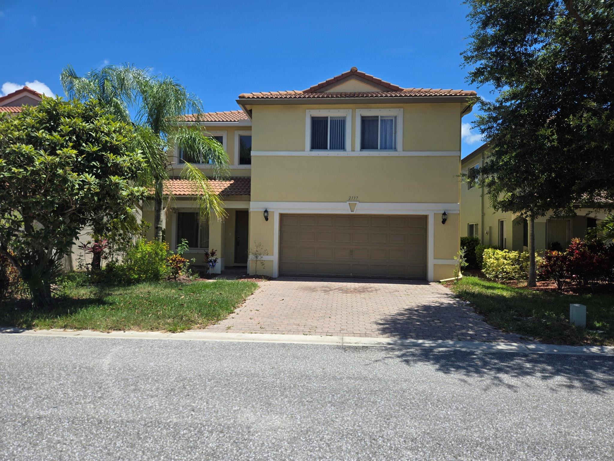 Stunning 4BR/3BA Home in a Gated Community in the heart of Palm Beach County, South Florida. Welcome to this spacious & beautifully maintained 2-story home offering 4 bedrooms, 3 baths, & a 2-car garage, nestled in a 24-hour manned gated community. Boasting 2,594 sq ft of living space. This home features a thoughtfully designed layout perfect for modern living. Enjoy the convenience of a first-floor bedroom and full bath, ideal for guests or multi-generational living, plus a mini office room downstairs for working from home. Upstairs, you'll find 3 bedrooms, a large loft area perfect for any of your desired use. The fully fenced backyard offers a few fruit trees & space for entertaining or relaxing outdoors. Community Amenities Include: pool, gym, tennis, playground, volleyball & more