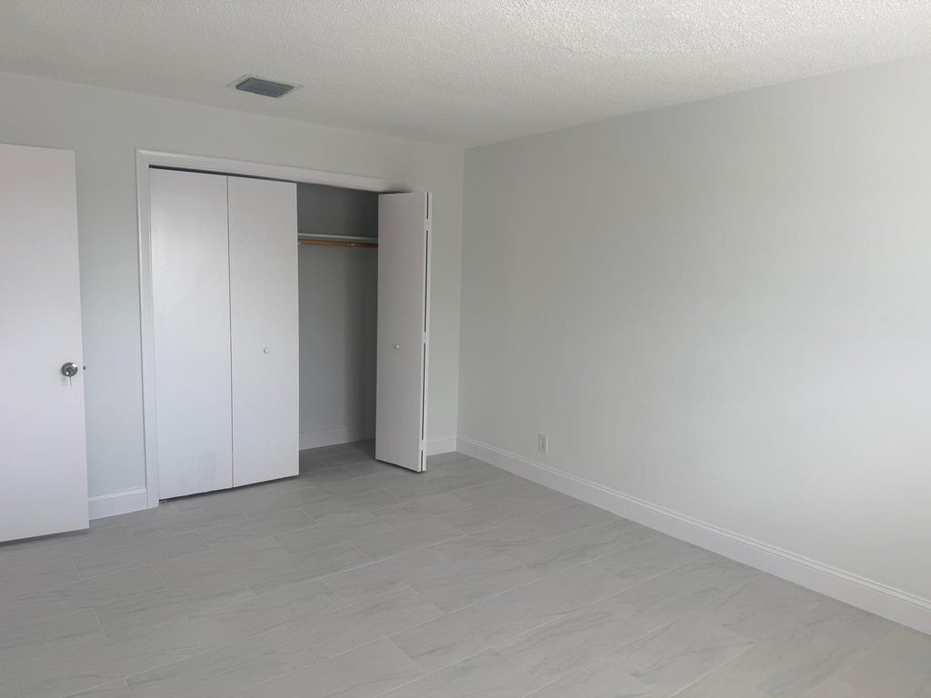 Photo of 402 Lake Shore Drive #202, West Palm Beach, FL 33403 (MLS # B26046040)