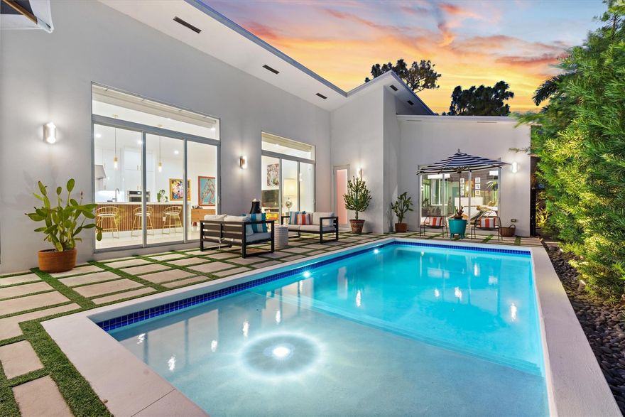 This Tropical Modern home perfect for Wilton Manors was custom built in 2018.  You’ll be wowed by its resort vibe with most rooms and cabana bath opening onto a private pool courtyard.  Effortless flow from inside to outside and high-end finishes make this home perfect for entertaining.  The primary suite features views of the pool and of the private garden with spa; its marble bath is a stunner with double vanity, double shower, walk-in closet and W/C.  The detached casita makes a fantastic guest suite with private entrance, pool views, ensuite bath, walk-in closet and kitchenette.  Just 2 blocks from Wilton Drive’s vibrant Arts & Entertainment district, this new construction home is Wilton Manors at its finest.  Priced to sell ($70K below appraised value); seller financing available!