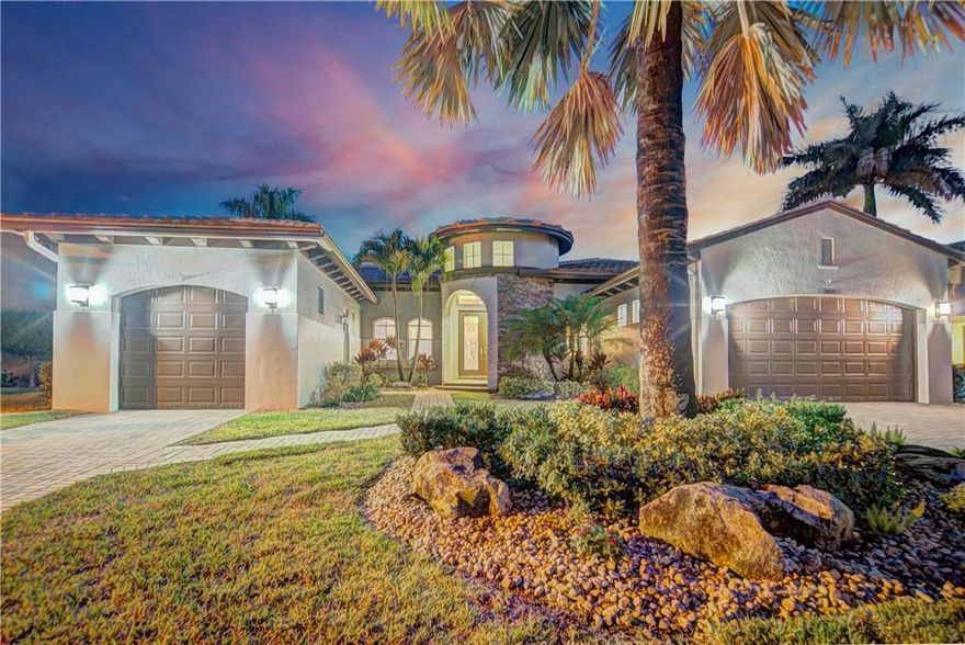 Amazing 4 Bedroom, 3 Bathroom Burgess Model w/ Over $65,000 In Upgrades! This Home Sits On A Fully Fenced, Large, Waterfront Lot & Has Plenty Of Room To Entertain. Enjoy Outdoor Living: Pool w/Travertine Deck, Custom Summer Kitchen, Screened-In Covered Porch & A Large Yard For Kids & Pets. Upgrades Include: Recently Painted Inside & Out, 2020 Both New AC's, New Pool Heater, Crown Molding, LED Lights & Custom Shades/Drapes  Beautiful Kitchen w/Granite Counters, Wood Shaker Cabinets, Stainless Steel Appliances Opens To Large Family Room w/Built-In Entertainment Center & Wine Fridge. Spacious Master Suite w/Large Sitting Area Is Perfect For Office Or Nursery. 3 Car Garage, Enjoy Living In Prestigious, Guard Gated Heron Bay w/2 Clubhouses, Resort Style Amenities & Attend All A-Rated Schools!