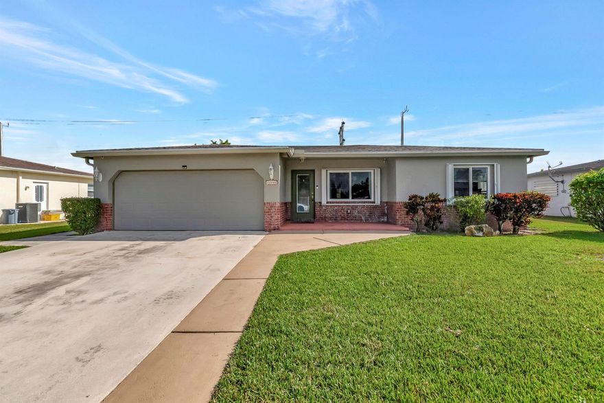 Updated and expanded 3-bedroom, 2-bathroom home nestled in West Boca Raton. Noteworthy improvements include a roof replacement and upgraded roof straps in 2020. This home boasts additional enhancements such as impact glass, an impact resistant garage door and pedestrian door, a newer air handler and compressor, revamped interior duct-work, upgraded flooring, and a replaced hot water heater. There is room for a pool in the backyard.  Situated in the Palmetto Pines neighborhood, this home offers proximity to excellent schools, parks, shopping centers, golf courses, and more. With its upgrades and strategic location, this property is truly a must-see.