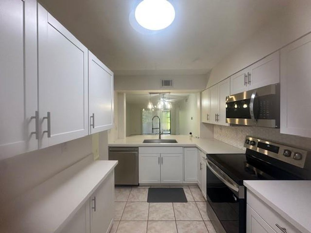 Photo of 3130 Millwood Terrace #115, Boca Raton, FL 33431 (MLS # F10519333)