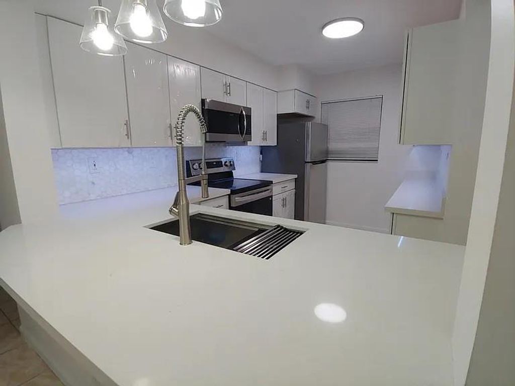 Photo of 3130 Millwood Terrace #115, Boca Raton, FL 33431 (MLS # F10519333)