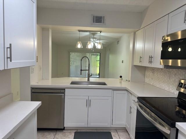 ALL AGES! Investor Friendly No WAITING TO LEASE! First floor 2/2 Turn Key with stunning modern updates. Quartz countertops, tiled backsplash and Stainless steel appliances approx 1 year new. White shaker cabinets expanded for add'l storage and prep station with chefs inlay sink. Tiled throughout. Updated bathrooms. Screened in covered patio with lush landscaping and privacy. Perfect for pets! 24/7 live manned security gate. Windwood HOA is beautifully maintained. Community features 20 acre lake, walk/jog paths,fenced dog park, 2 pools,tennis/raquetball,carwash area,basketball/handball, BBQ+ Perfect for FAU/PBSC,LYNN Students/staff and convenient to Boca Community Hospital. Approx 1.5 miles to Beach. HOA fee also includes WATER,SEWER,TRASH & BASIC CABLE.