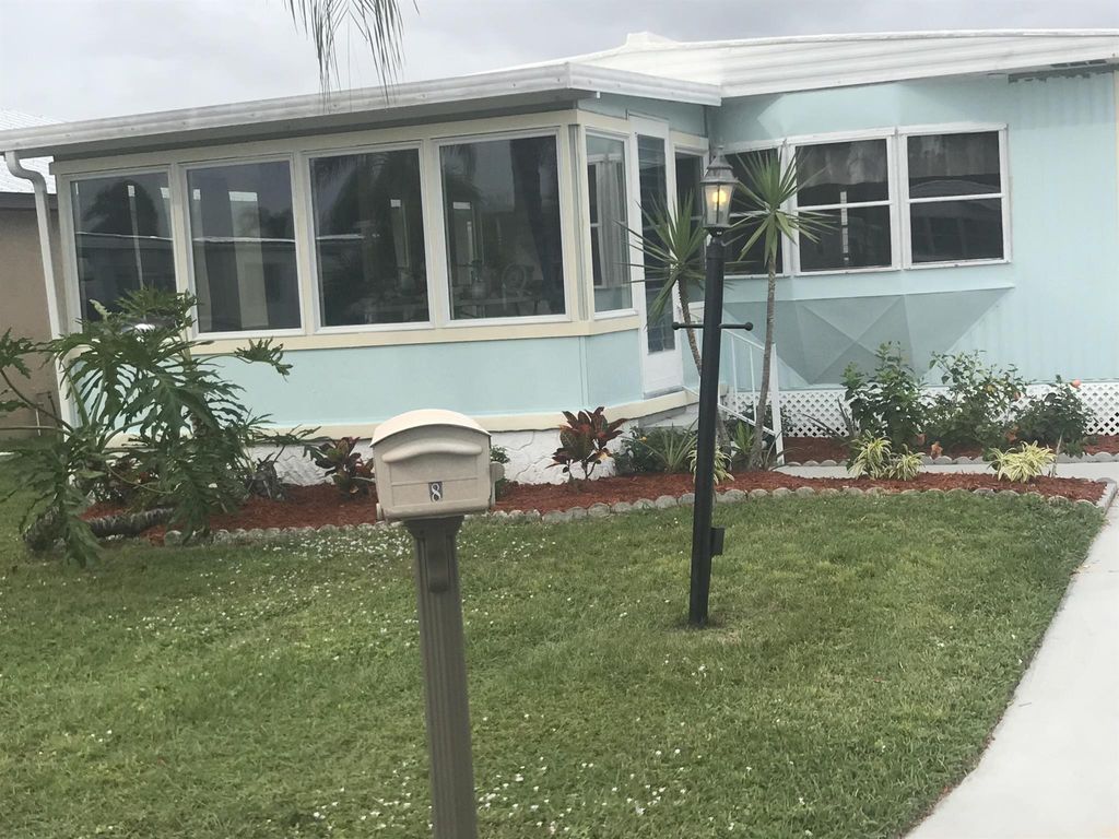 Photo of 8 Brisa Lane, Port Saint Lucie, FL 34952 (MLS # R10954395)