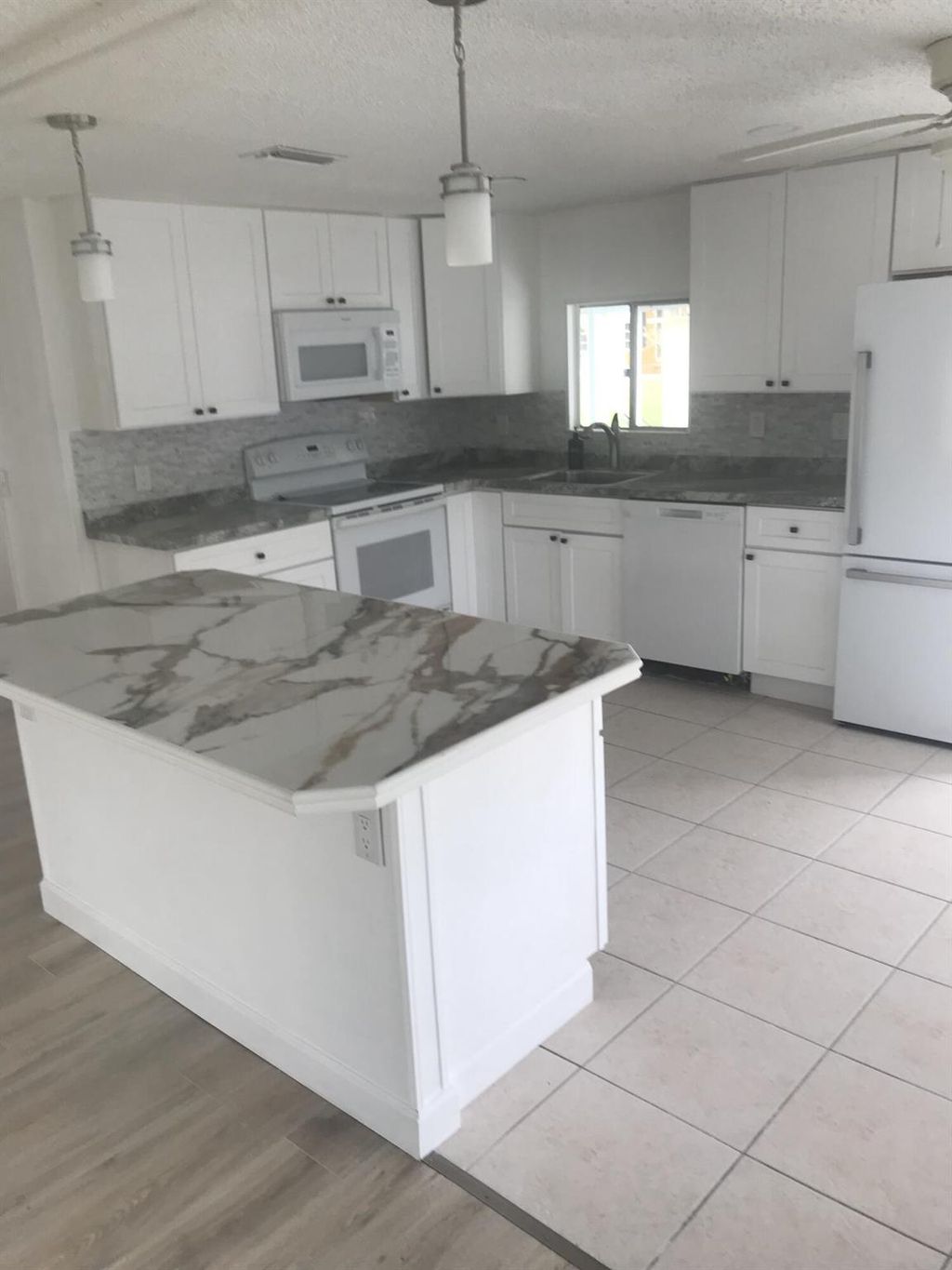 Photo of 8 Brisa Lane, Port Saint Lucie, FL 34952 (MLS # R10954395)