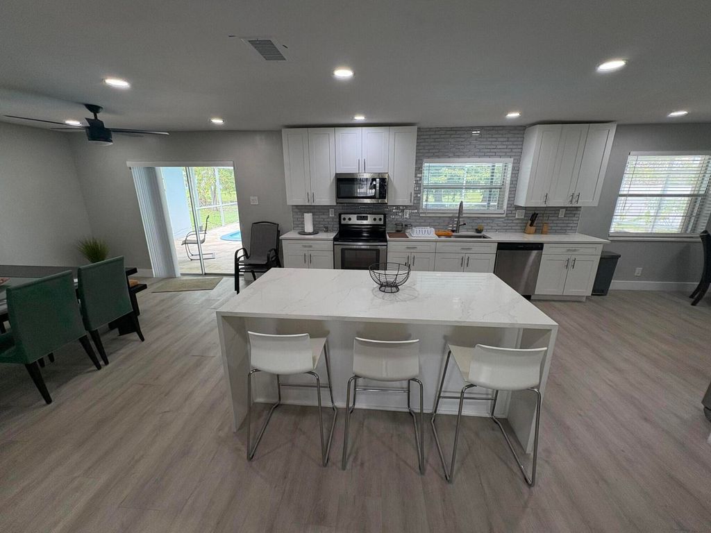 Photo of 1401 NW 75th Terrace, Plantation, FL 33313 (MLS # B26012849)