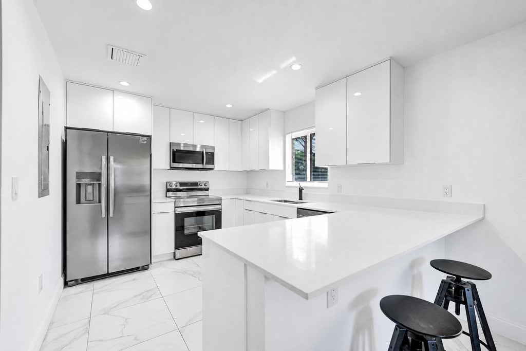 Photo of 830 NW 19TH Street, Fort Lauderdale, FL 33311 (MLS # B26077709)