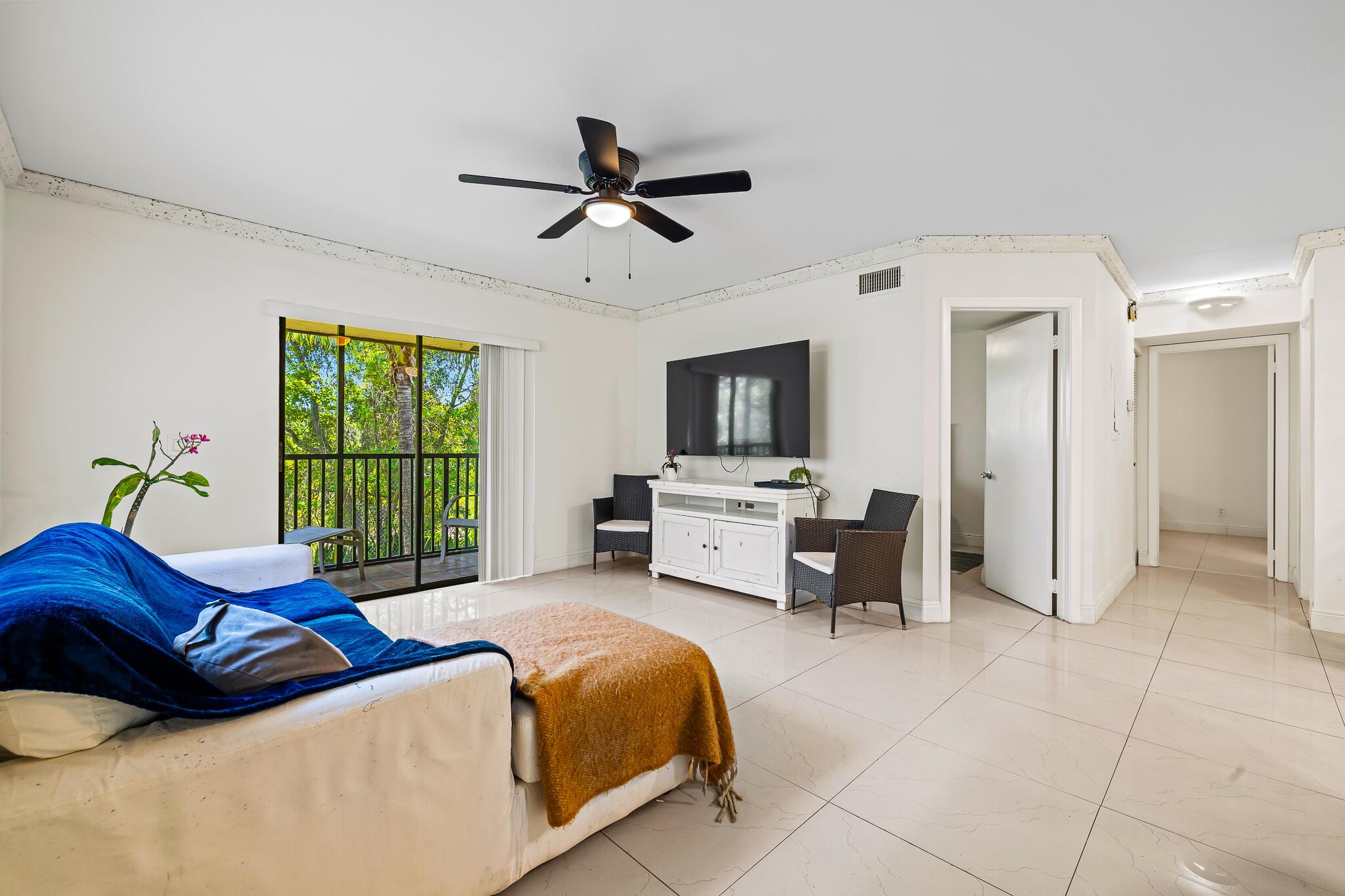 Great condo value and location in the heart of Deerfield Beach. This updated corner unit, located in popular Tivoli Trace (an all ages low condo fee community with excellent reserves) is nestled in front of the serene nature preserve offering peaceful views from your screened in balcony. Offering 2 bedrooms and 2 updated bathrooms, porcelain tile floors, updated kitchen with white cabinets and quartz countertops and in unit washer and dryer. The community offers resort style amenities including heated pool and jacuzzi and is located minutes from the beach, I95, shopping and dining.