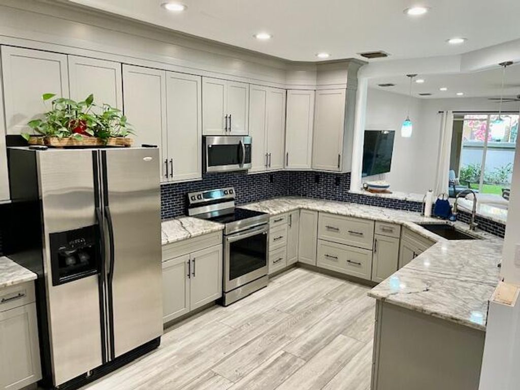 Photo of 4851 Bonsai Circle #107, Palm Beach Gardens, FL 33418 (MLS # R11153566)