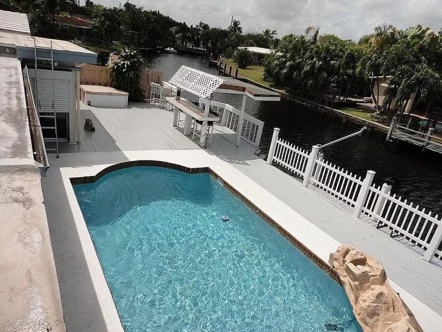 *Updated 3/22* TENNANTS ARE OUT! HUGE 2800 SQFT TA REMODELED 4/3. 80' OCEAN ACCESS CANAL OFF MIDDLE RIVER. CHEF KITCHEN WITH WET BAR WINE FRIDGE, POOL, HOTTUB, WATERFALL, DOCK, GARAGE AND CARPORT! Impact windows front, electric rolldown shutters back. Totally remodeled open concept with 70k - 40 year life metal roof 8 yrs old, 24"Italian marble throughout, 18” terrazzo in bedrooms, large chef's kitchen, new GE Profile appliances, 8K Thermador double oven and tons of granite with 8 foot island, 2way fireplace, 4 yr Westinghouse 5 ton air-conditioner, 10yr 2.5ton on other. Tikibar, Bose Speakers. Only house in neighborhood with garage AND carport. Running/biking paths, volleyball, tennis. Playground/lake at end of the street. All Information provided is believed accurate but not guaranteed.