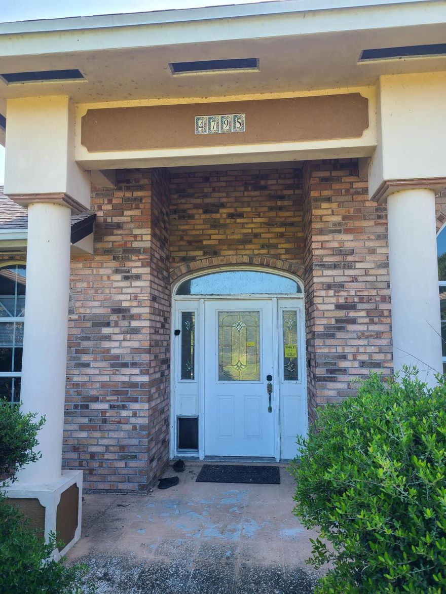 Restore and reimagine this spacious 3-bedroom, 2-bath CBS home on 2 beautiful acres in desirable Fort Pierce FL off Midway Rd. Priced to sell, this handyman special has amazing potential and built-in equity—investors or visionaries dream. Zoned for animals and home-based businesses, it provides endless options for customization and lifestyle flexibility. The open kitchen with a large island and breakfast nook is great for entertaining. The oversized primary suite features a tray ceiling, dual walk-in closets, and a luxurious bath with soaking tub and separate shower. Enjoy three sets of French doors leading to a massive 2,000 sq ft covered porch—already permitted to be enclosed. A detached 1,000 sq ft garage adds excellent workspace or storage. Roof replaced in 2018. Wi th TLC, this could be a truly stunning estate. Seller would like a fast Close.