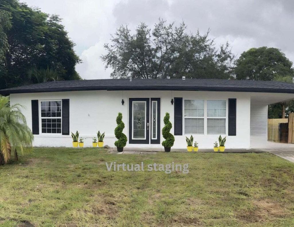 Photo of 402 NE Armony Circle, Port Saint Lucie, FL 34983 (MLS # R11040110)