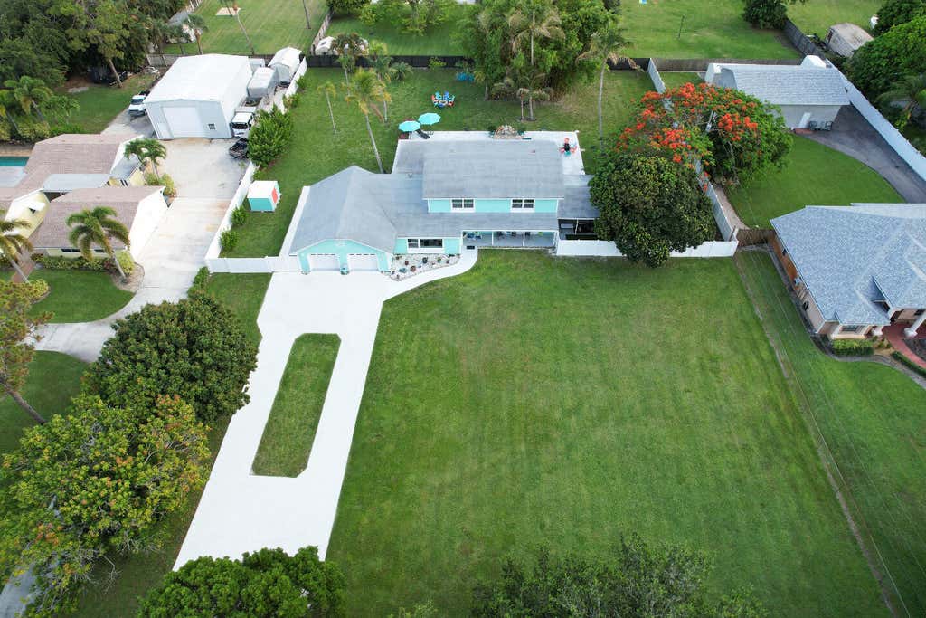 Photo of 5078 CANAL Drive, Lake Worth, FL 33463 (MLS # B26069149)