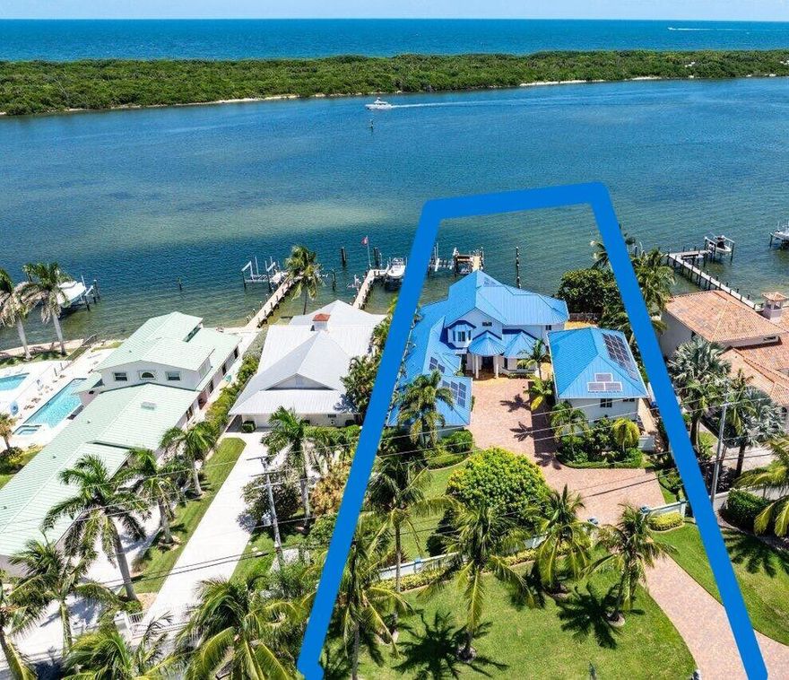 BRIGHT BLUE WATER!  105' on IntraCoastal!  Across from Blowing Rocks Preserve. NO FIXED BRIDGES. RARE Multi Vessel Dock 112' Feet Long. WATER DEPTH 11 - 13 FEET!.  Tidal Slide Slip ~70' Vessel. LIFT 15,000 LB ~40' Vessel +Jet Ski Cradles.  LIFT 1500 LB Whaler or Jet Skis!  Paddle Board/Kayak Racks. GATED~1/2 acre. Toys w TIRES?  5 CAR GARAGE.  Oversize 2 Car+Oversize 3 Car w A/C WORKSHOP!  GUEST HOUSE is separate structure at Poolside. (1,056 SF w Living, FULL kitchen, Bed, Full bath 2,140 SF Total).  ALL IMPACT GLASS.  METAL Roofs~ 2016. Newer HVACs. Pool Reno 2011. Whole PROPERTY Generator 36KW w1000 g Tank. Solar Assist Elec Sys. Water Filtr Sys (Public W).  6 Camera Sec Sys. Irrigation Sys (Well). Paver Dr.  Floor Plans+ Survey available. ZONING is R-3A Multi. AMAZING OPPORTUNITIES!!!