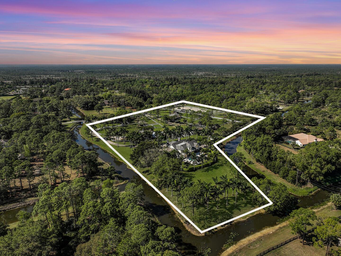 GardensExperience the ultimate in luxury equestrian living at 14639 Crazy Horse Lane, a 10-acre estate in the prestigious Caloosa community. This meticulously maintained property offers unparalleled facilities for horse enthusiasts alongside a private main house with a pool and a charming guest house--ideal for family, staff, or guests.Equestrian Features:Arena: 220' x 110', IDA Premier Footing (2022) with a covered viewing pavilionHorse Exerciser: Six-horse capacity with new Equine flooring (2022)8 Pastures: Water access, 6 Tiki hut run-ins (2 with field stalls), 2 medical paddocksFencing: White PVC, fenced and cross-fencedBarn Features:6 Stalls: Four 14' x 12', two 8' x 10'Aisle: Rubber paver flooringRooms: A/C tack room/office, feed room, 5 grooming stalls