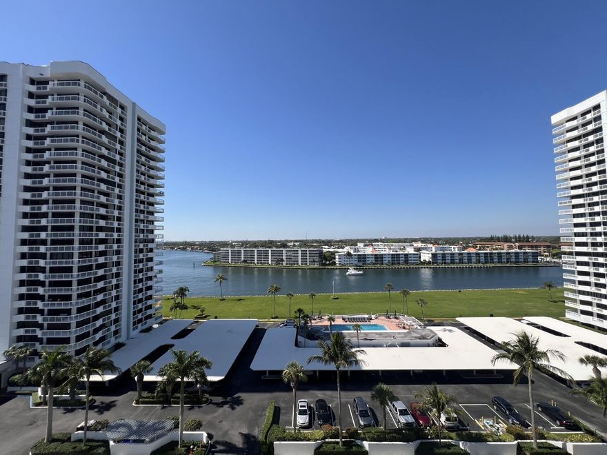 Breathtakingly renovated 2BR/2BA corner condo in NPB with a SE exposure, offering panoramic ocean & Intracoastal views. This light filled residence has been completely transformed with premium finishes & modern coastal elegance throughout. The stunning new kitchen features Italian cabinetry, quartz  countertops, LG stainless appliances, a spacious entertaining island, & a dedicated bar area with a wine refrigerator. New porcelain flooring, new bathrooms, & recessed low voltage lighting throughout the condo's contemporary feel. The expansive wrap-around balcony captures spectacular water views from sunrise to sunset. The spacious primary suite includes two walk in closets,  luxurious new bath with dual sinks & porcelain flooring. Upgrades include a new electrical panel, New Impact Sliders. Condo is located in a 24 hour gated community, exceptional amenities include a stylish community room, spectacular waterfront pool overlooking the marina. This condo is 15 minutes to the beach.