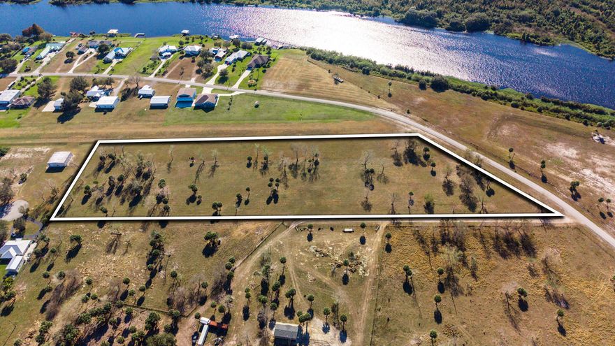 Discover a rare opportunity to own 8.67 acres which backs up to the River Oak Acres subdivision in western Okeechobee County.  This beautiful property backs up directly to River Oak Acres' 4,700 foot lighted airstrip, ideal for aviation enthusiasts, while also being located directly across the street from scenic Kissimmee River.  This property awaits your dream home with the freedom of NO HOA.  The expansive acreage offers plenty of room for a custom home, hangar, workshop or recreational use, all while surrounded by natural Florida beauty.  A rare find! This property combines privacy, potential aviation access and river proximity.  In order to use the River Oak Acres airstrip, you will have to join their HOA.