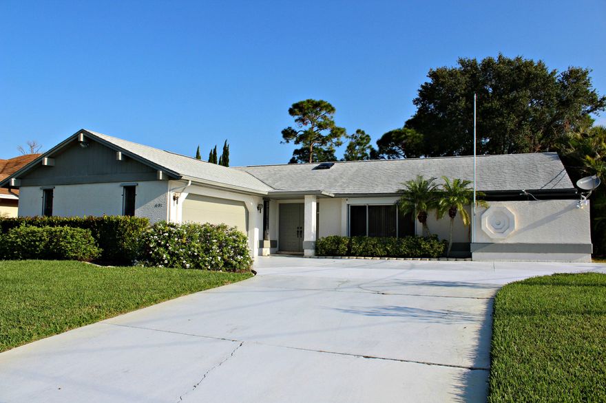 **3rd BEDROOM/DEN HAS NO CLOSET BUT CAN BE ADDED)** GREAT LOCATION ON PICTURESQUE CANAL WITH DOCK!  FENCED YARD, FLORATAM SOD W/IRRIG. SYSTEM & 2 WELLS - GARAGE IS 22X25 & INCLUDES WORK SHOP. HUGE PORCH W/ SCREENED LANAI OVERLOOKS TRANQUIL SETTING.  SPACIOUS FLOORPLAN (SEE ATTACHED BUILDER'S SKETCH IS SMALLER VERSION OF SUBJECT PROPERTY). . NEWER APPLIANCES, HVAC NEW 2012, POWER SURGE PROTECTOR, STORM SHUTTER INCL. ROLLER FOR PORCH & PICTURE WINDOW, MOTION SENSORS, NEW ROOF 2014 W/RUBBER UNDER LAYMENT, POCKET SLIDERS TO PATIO - WIRED FOR CHRISTMAS LIGHTS!  TRULY  A CUSTOM HOME IN IMPECCABLE CONDITION.