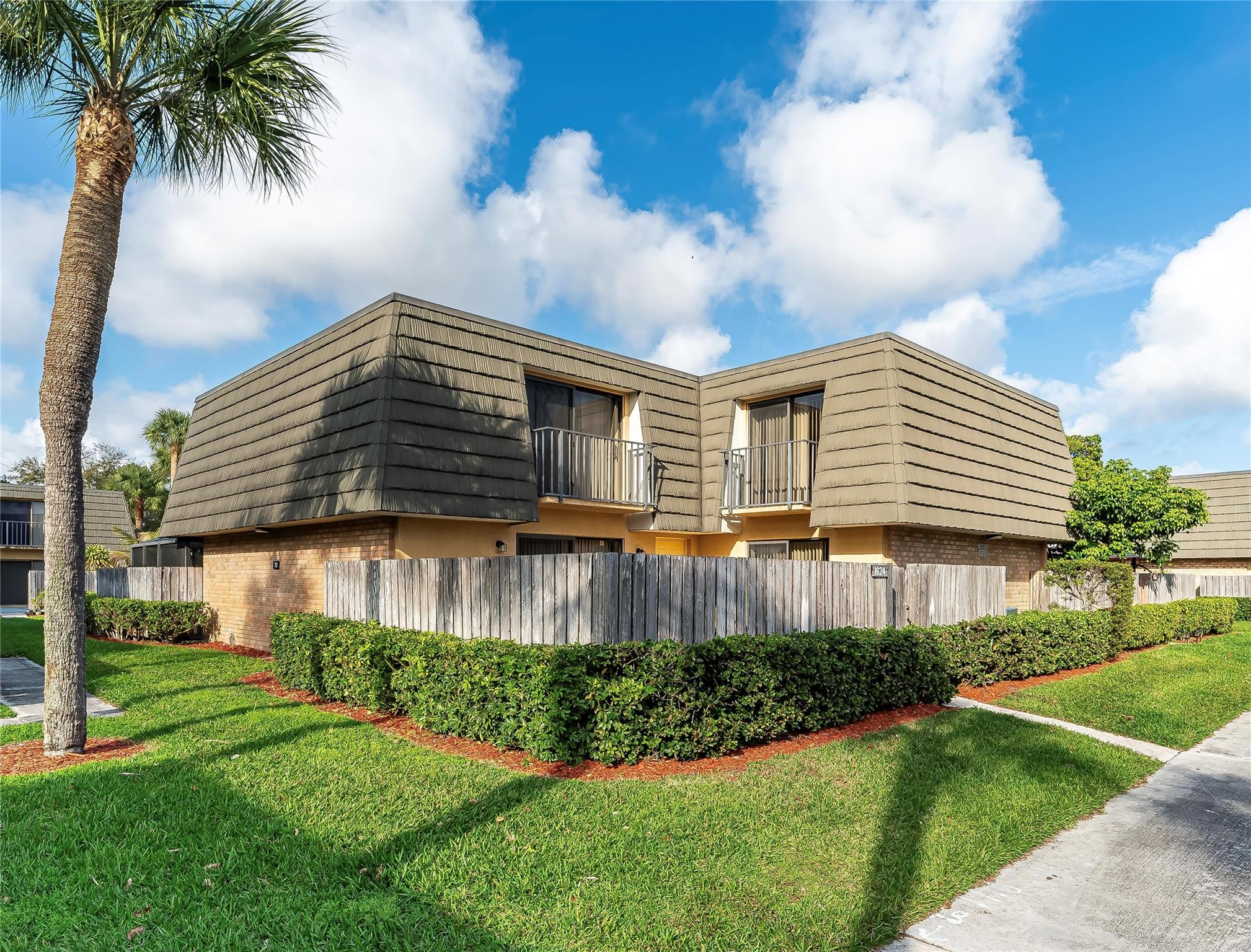 ***$1500 BUYER CLOSING CREDIT*** Charming 2/2.5 townhouse in the heart of Village of Sandalwood Lakes- ready for immediate move in w/ new courtyard fence, newly painted interior (incl ceilings), new blinds throughout, and newly planted front shrubs. Screened sliding doors upstairs (w/ balconies) & downstairs allow for lots of natural light. Interior storage room downstairs & exterior storage area on large courtyard (incl water hose). Walk-in closet in primary bedroom & full wall length closet in 2nd bedroom. Roof replaced 2015. 2 assigned parking spots. HOA fee incl cable, internet, water/sewer/trash, exterior building maintenance, & building insurance. Vacant & easy to show. Listing photos taken prior to new fence/shrubs/blinds - see last 2 photos for update. Some photos virtually staged.
