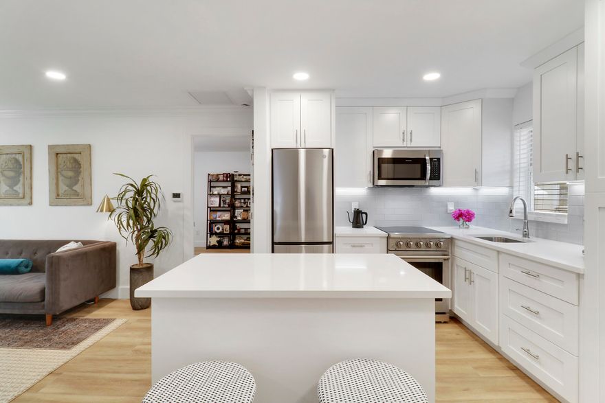 Step inside this stunning, light-filled 1BR/1BA condo featuring an inviting open-plan layout that masterfully blends style and functionality. Completely upgraded this cozy home offers modern finishes, tile floors throughout and a spacious bedroom with generous closet space. Impact sliding doors lead to enclosed sun room overlooking the canal. A/C is 2026. Washer/Dryer in unit. Located on a quiet street, Meridian Park is a 55+ community with a heated pool on premises, and reserved covered parking. Centrally located to stores and restaurants. 10 miles to Palm Beach International Airport. Perfect for full-time or seasonal living!