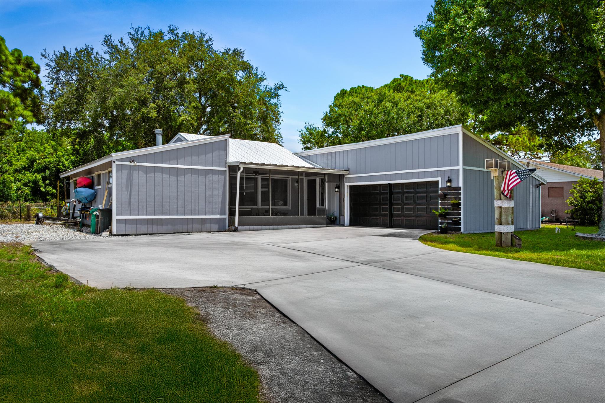 Welcome to this unique 3-bedroom, 2-bathroom Florida home located in the desirable Indian River Estates community! This property features a 2018 metal roof, oversized driveway, and a screened-in front porch--perfect for enjoying your morning coffee or relaxing in the evenings. The fully fenced yard offers privacy and space for kids or pets to play, making it ideal for families. Nestled in a kid-friendly neighborhood with a laid-back vibe and close proximity to parks, shopping, and beaches, this home offers the best of Florida living.
