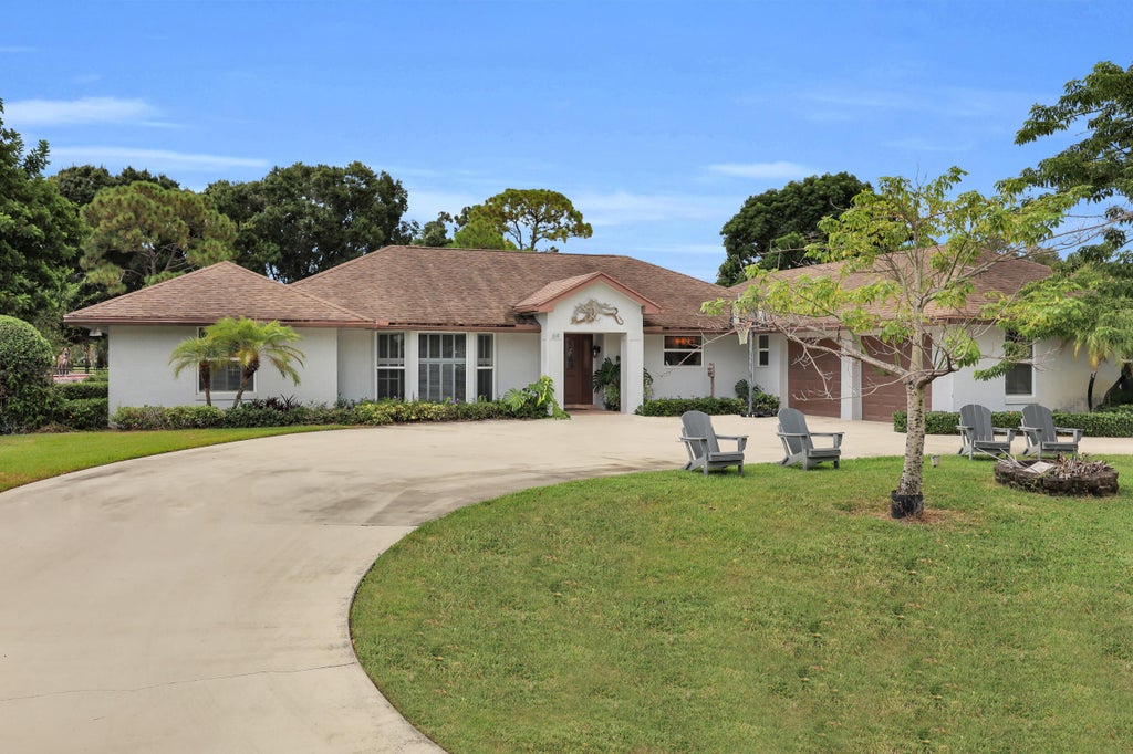 Photo of 64 SE Turtle Creek Drive, Tequesta, FL 33469 (MLS # B26069096)