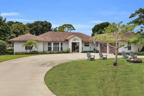 Photo of 64 SE Turtle Creek Drive, Tequesta, FL 33469 (MLS # B26069096)