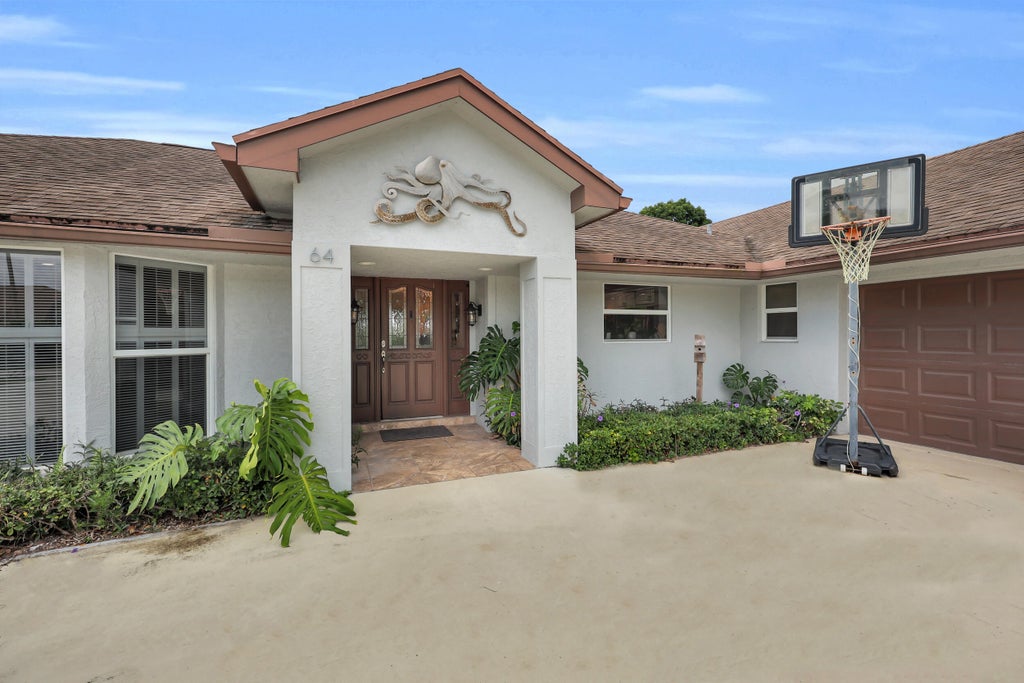 Photo of 64 SE Turtle Creek Drive, Tequesta, FL 33469 (MLS # B26069096)