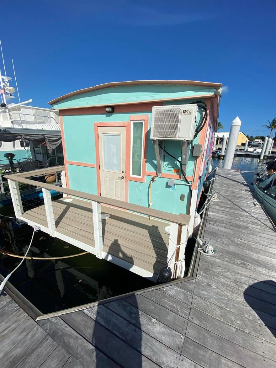 AFFORDABLE WATERFRONT LIVING IN KEY WEST !
Very nice 32' Custom Built floating home moored in a live aboard slip on a state of the art floating dock in central Key West.
Live safely ON the water in Key West without paying millions !
Well maintained.  one bedroom, one bath, kitchen/dining area, living room, bath & shower,. front a rear deck/landings.
 Sale contingent upon Leasehold Transfer approval.  Low slip fee of $ 736 per month includes free pump out, 2 parking passes, 2 very clean and well maintained laundry and shower facilities available.  City charges 4% transfer fee for Lease transfer, plus 1st/last/security