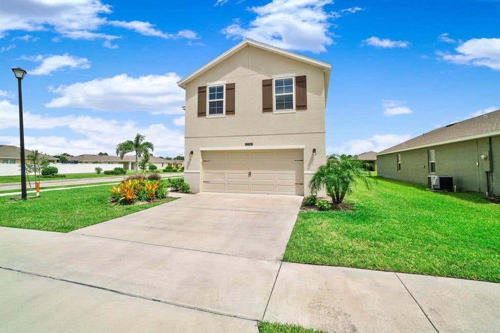 Photo of 11242 SW Sophronia Street, Port Saint Lucie, FL 34987 (MLS # R10722637)